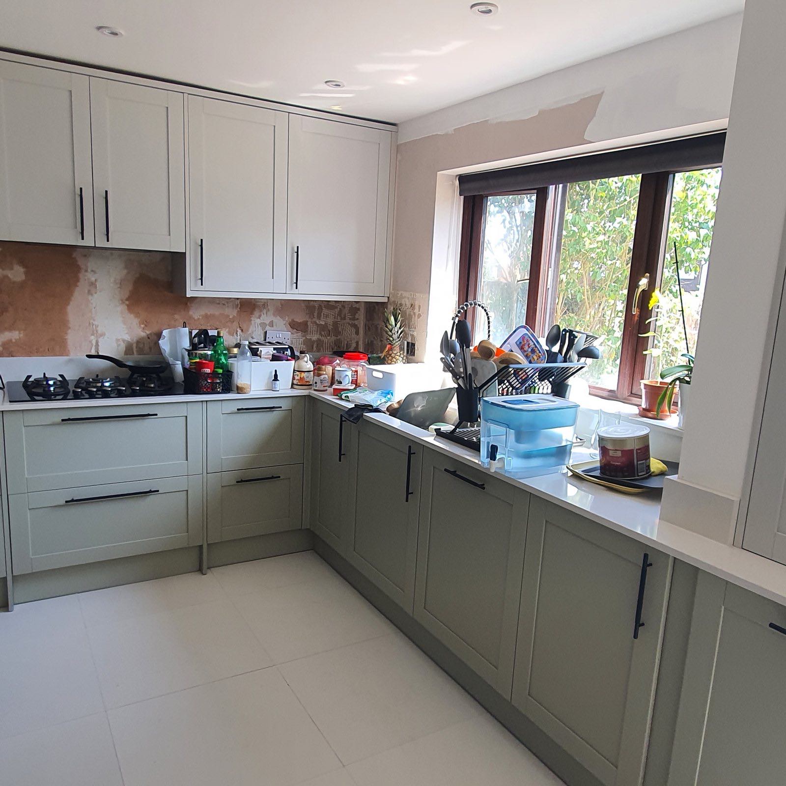 After: the finished pale green shaker kitchen with white worktops by ATR Kitchens and Bathrooms