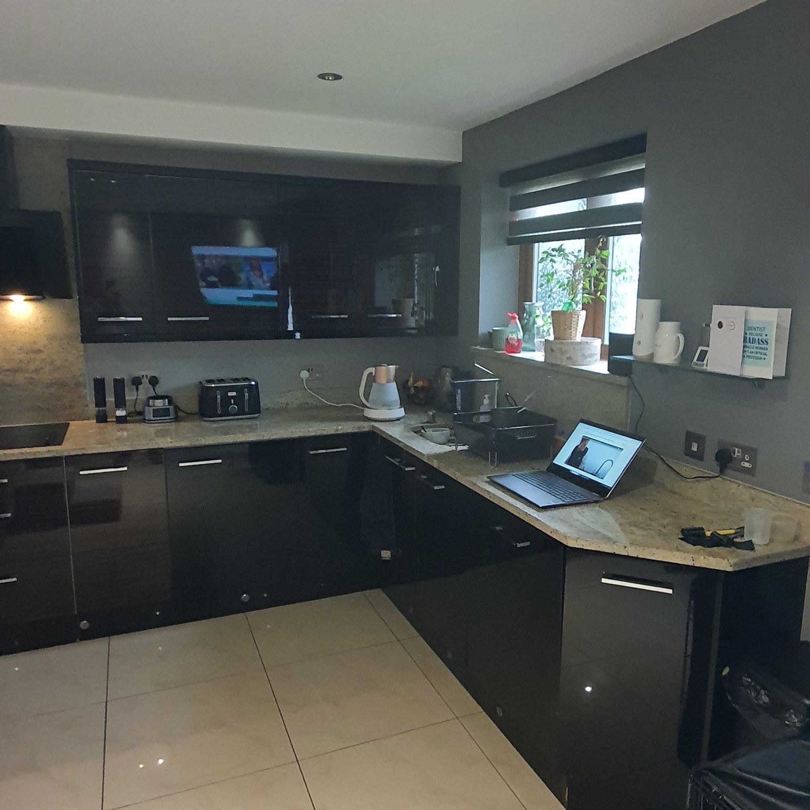 Before: the old dark gloss kitchen before the refit
